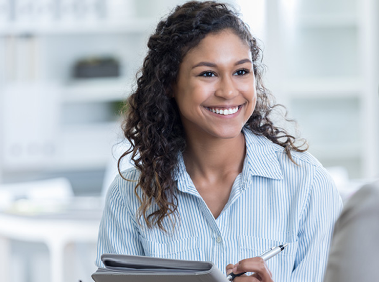 A woman smiles.