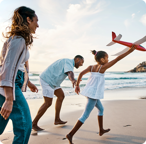 Image of family playing together on the beach