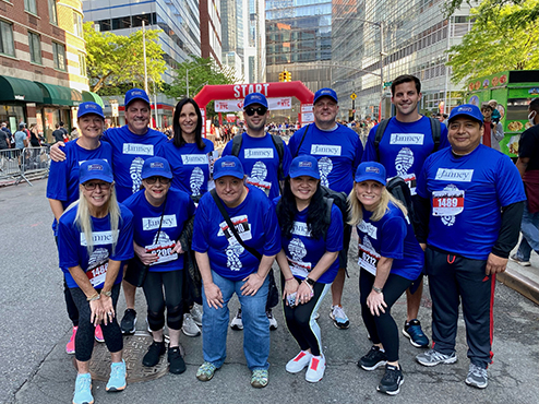 Janney employees pose in Manhattan prior to participating in the Wall Street Run & Heart Walk