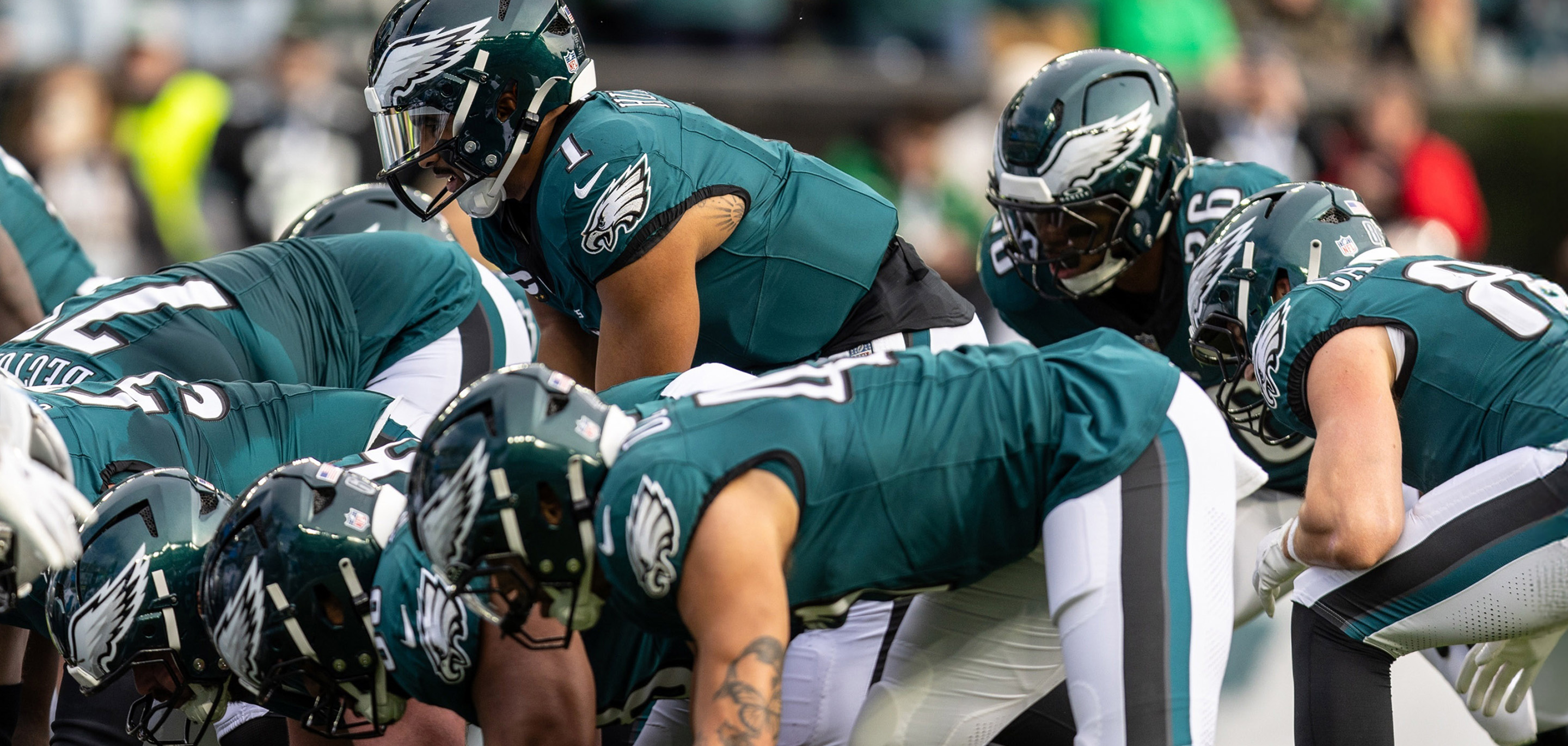 Photo of Eagles players on a football field.